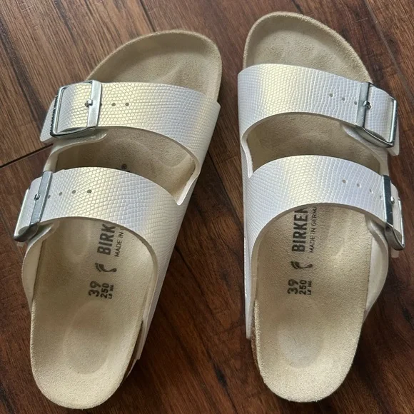 Birkenstock White Sandals with Silver Buckles - Picture 1 of 4